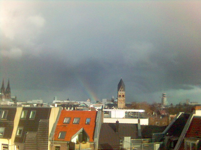 Fr�hling l��t sein blaues Band... kirchturm dom himmel regenbogen sonne wolken k�lner dach d�cher 